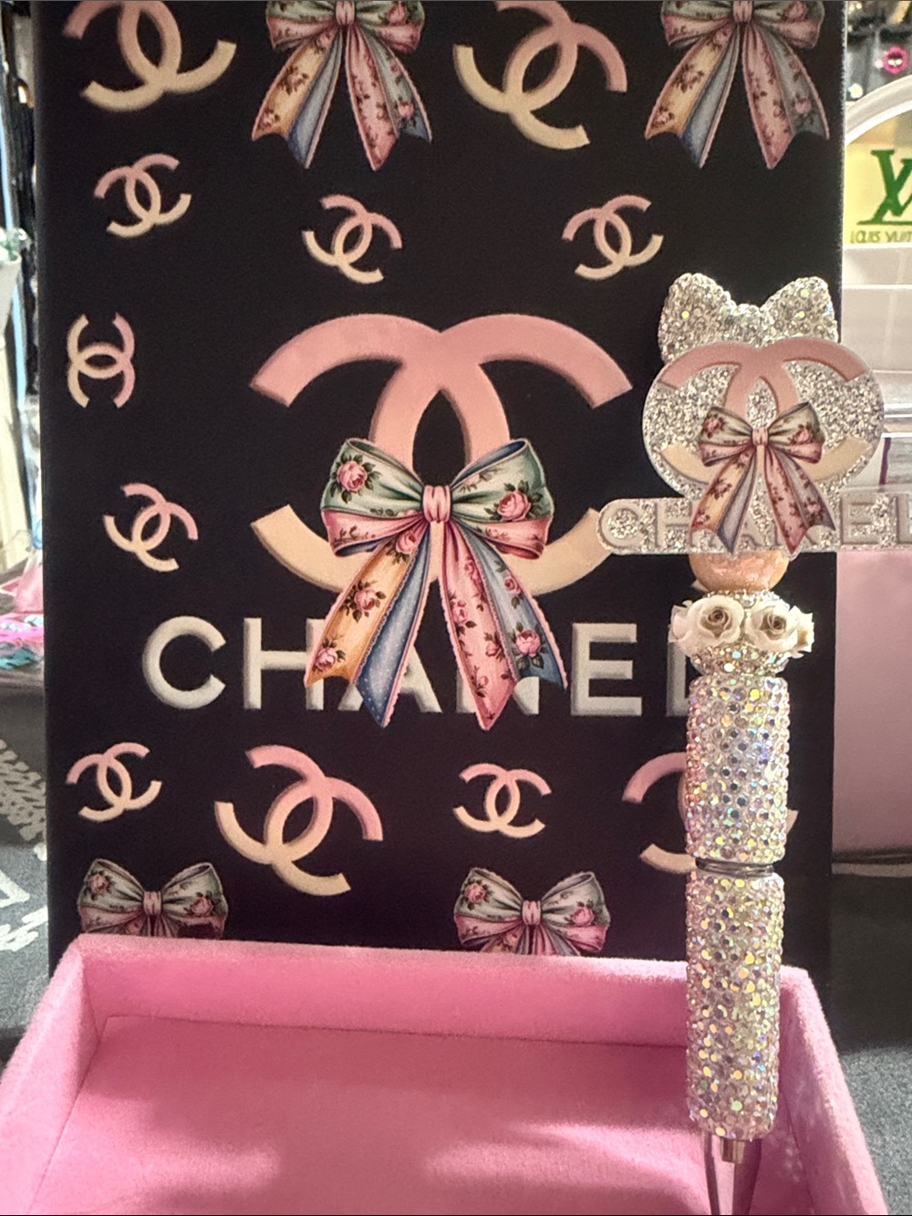 Black and pink journal with matching rhinestone pen.